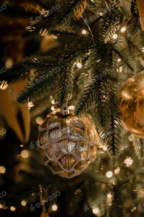 Preview: The background is a close-up of a Christmas tree decorated with golden toys, lights and flags.
