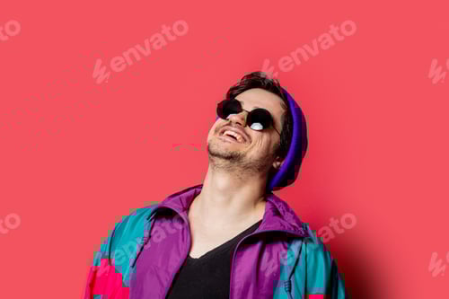 Preview: Funny guy in 80s style jacket and sunglasses on red backgorund