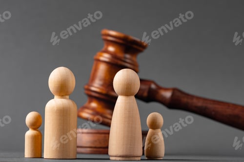 Preview: Wooden toy family and judge mallet. Family divorce concept