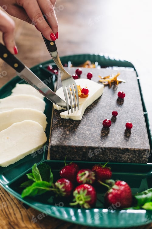 Vorschau: Mozzarella cheese in wooden bowl on white rustic table top view. Soft italian cheese