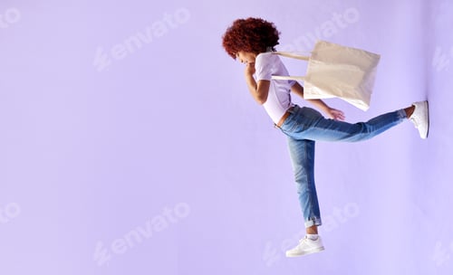 Preview: Fashion, shopping and a woman walking on mockup in studio on a purple background for advertising. R