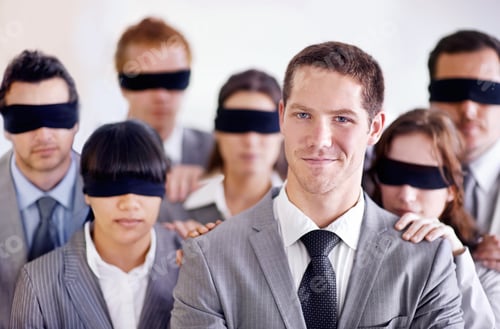 Preview: A young businessman standing in front of a group of blindfolded businesspeople