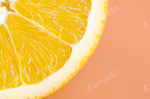 Preview: Top view of a one orange fruit slice on bright background in orange color