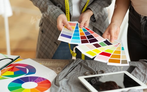 Preview: Female fashion stylist and customer holding color samples