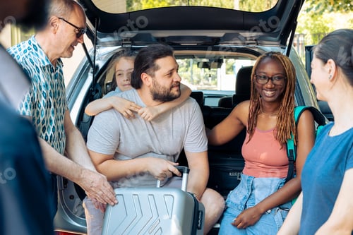 Preview: Diverse family and friends loading trolley