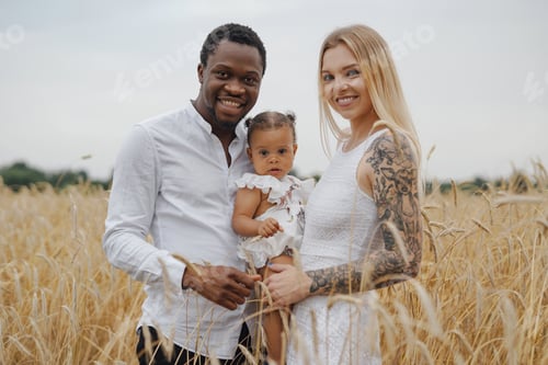 Preview: Mixed race parents and their daughter together on vacation