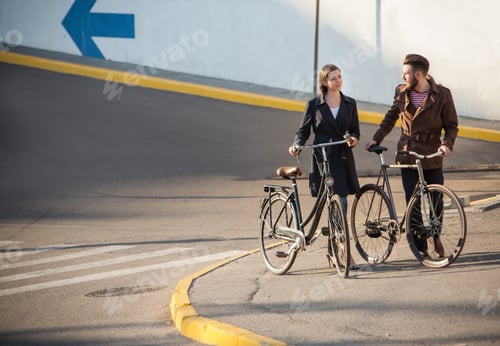 Preview: Young Couple With A Bicycle Opposite The City