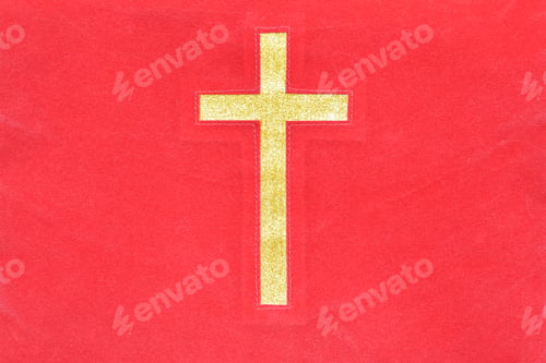 Preview: Gold catholic cross on red cloth texture