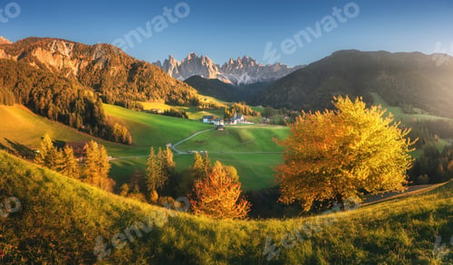 Preview: Autumn trees, village with houses, church, green meadows, rocks