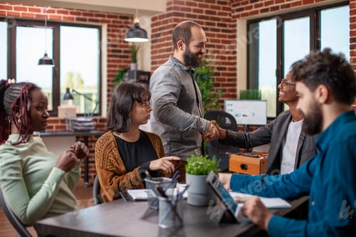 Preview: Manager greets colleague at meeting