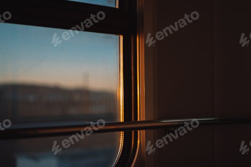 Preview: Car window inside the train against the sky and mountains
