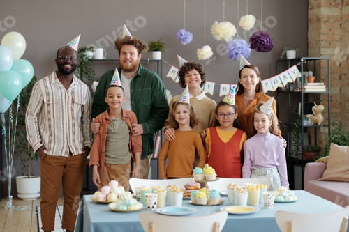 Preview: Happy adults with children at birthday party