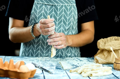 Preview: Closeup process making homemade pasta. Chef cook cutting with knife
