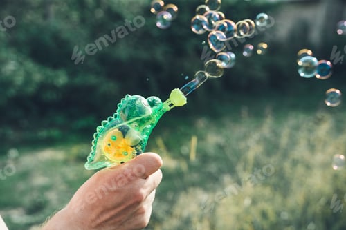 Preview: Dinosaur soap bubble gun shooter, blower. Party for kids. Girls,chidren playing funny family game wi