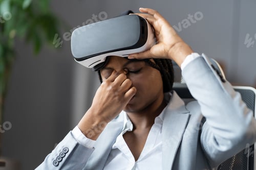 Preview: Woman Experiencing Technology Challenges Wearing a VR Headset