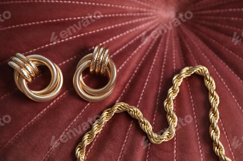 Preview: Beautiful gold jewelry on velvet fabric, closeup