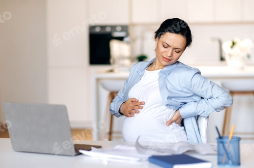 Preview: Tired pregnant woman designer table sitting backache