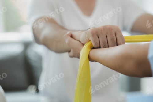 Preview: Physiotherapist is doing physical therapy for a patient, the patient has body aches due to overwork