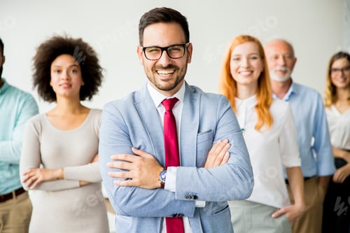Preview: Young business people with senior colleague