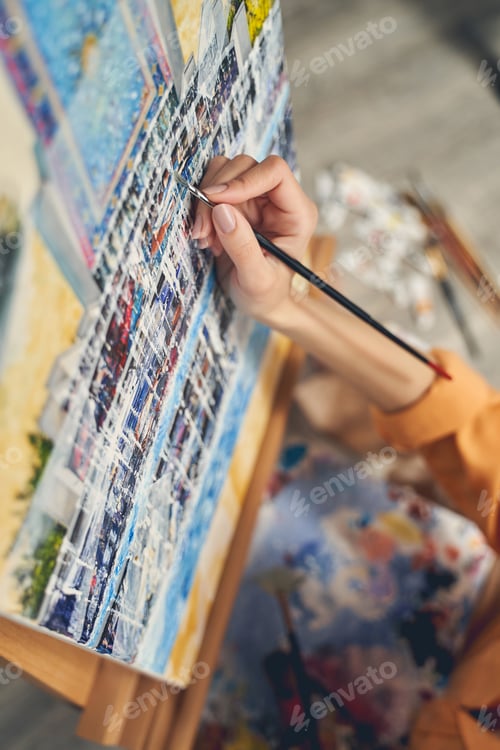 Preview: Female artist painting beautiful abstract picture at home