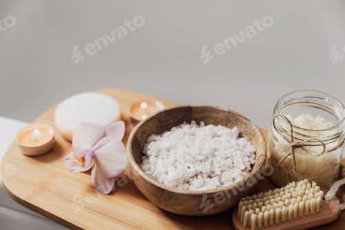Preview: Hotel spa treatment or home bath procedure. Bathroom with accessories on tray