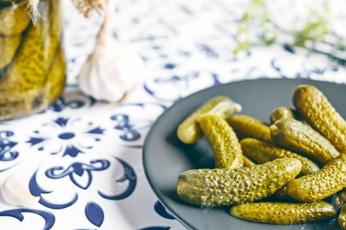 Preview: Salted pickled cucumbers preserved canned in glass jar.