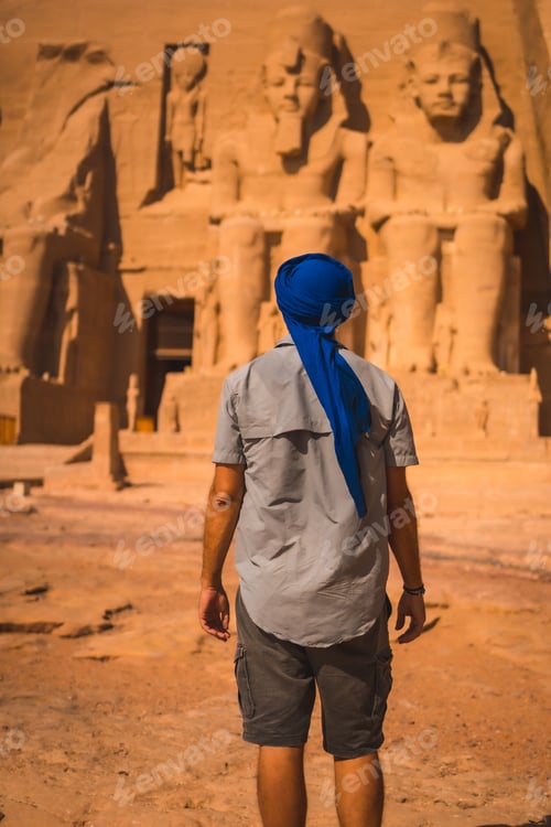 Preview: A Young Tourist In A Blue Turban Looking At The Abu Simbel Temple In Southern Egypt In Nubia Next