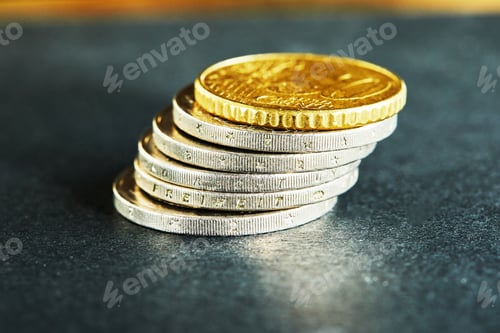 Preview: Coins stacked on each other, close up picture, market crisis and fragile marke