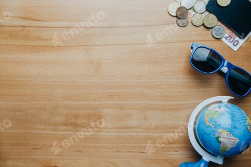 Preview: Travel background with coins, cards, mobile phone, globe and coffee. top view empty space for text