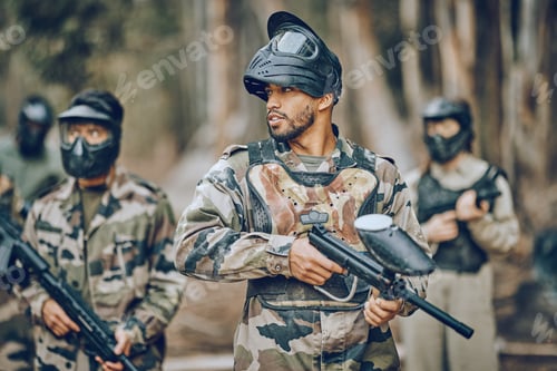 Preview: Paintball, sports and team with gun in woods ready for games, arena match and shooting battle outdo