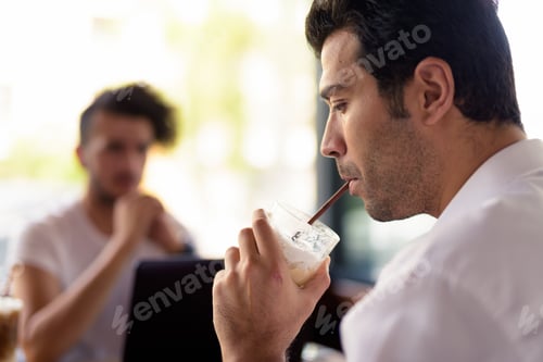 Preview: Two handsome Turkish men hanging out and relaxing at the coffee shop