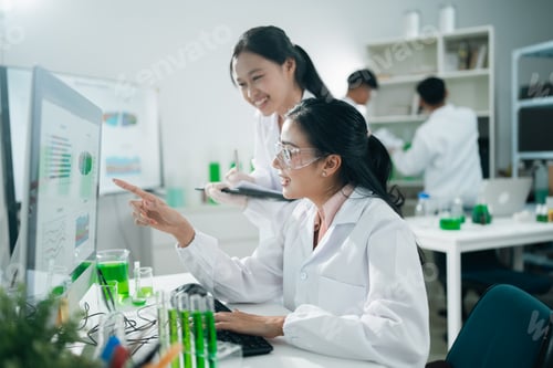 Preview: Research team analyzing experiment results with glassware and chemicals in a modern medical