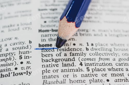 Preview: Macro shot of a blue pencil underlining the word 'home' in the dictionary