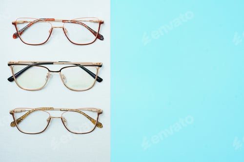 Preview: Stylish eyeglasses over background. Optical store, glasses selection