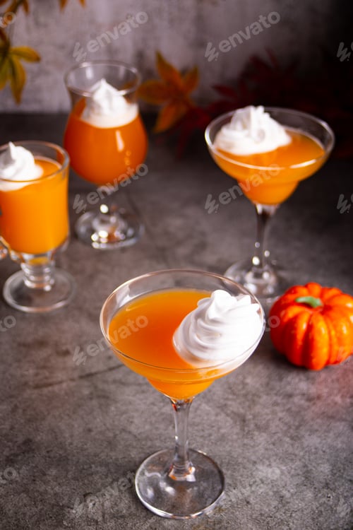 Preview: Pumpkin fall seasonal drink cocktail latte with spices and whipped cream for Thanksgiving