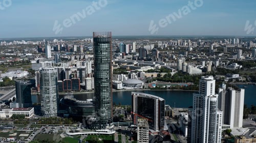Preview: Tall buildings with blue windows taken from a drone. Stock footage. A magnificent landscape of a big