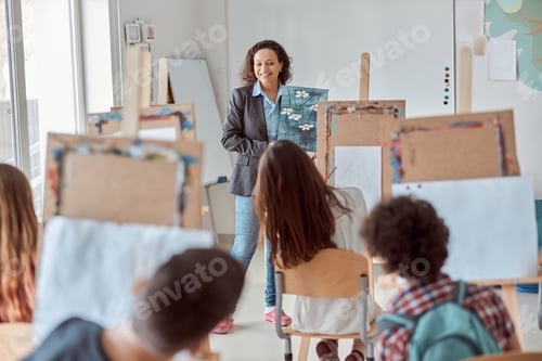 Preview: Young creative happy pupils at light modern classroom are doing drawing lesson
