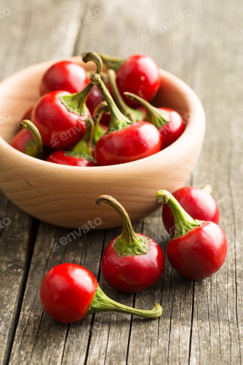 Preview: Red chili peppers in bowl.