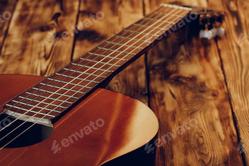 Preview: Wooden acoustic guitar body and fingerboard close up