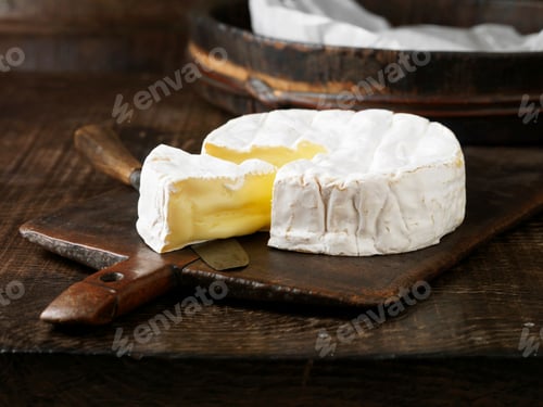 Preview: Sliced Camembert cheese on board