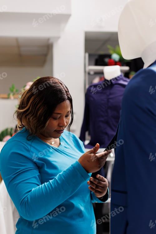 Preview: Woman looking at elegant suit