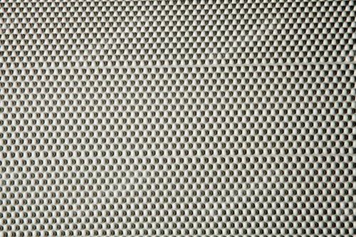 Vista previa: Fondo industrial texturizado con remaches con patrón de burbujas