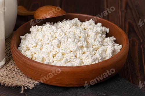 Preview: Bowl of cottage cheese on wooden table