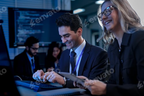 Preview: software developers smile with satisfaction during a pair programming session