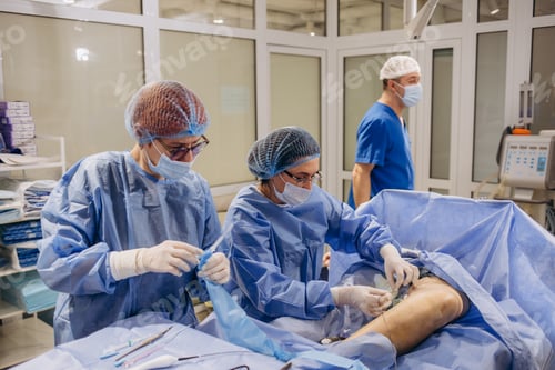 Preview: Surgeons Performing Operation in Hospital Operating Room