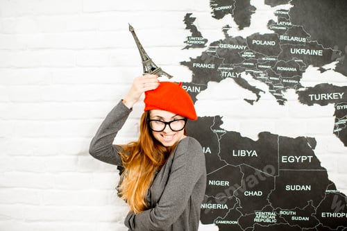 Preview: Woman dreaming about a trip to Paris