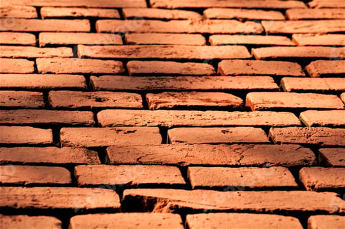 Preview: Vintage red brick wall in sunlight