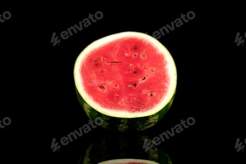 Preview: A whole big watermelon on a black table background. Green, hard and striped watermelon