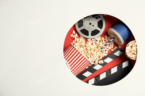 Preview: Composition with popcorn, cinema reel and space for text on color background, top view
