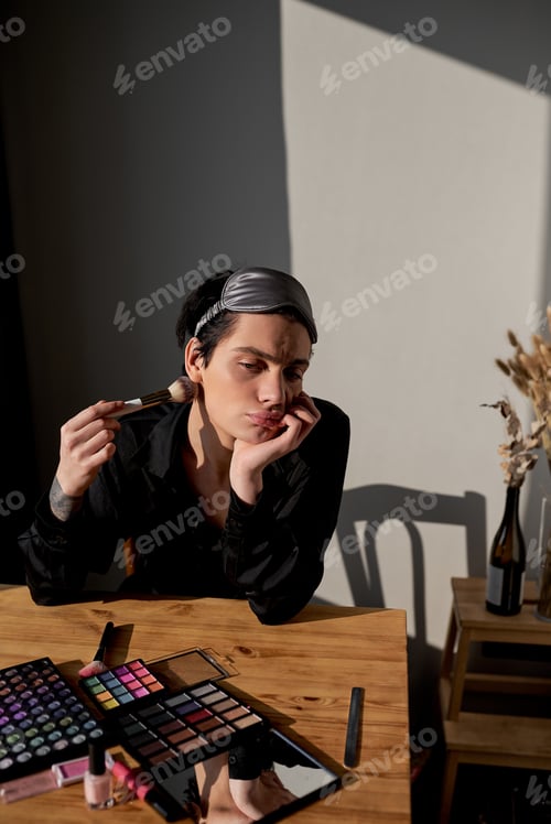 Preview: sad unhappy depressed transgender sitting on the chair